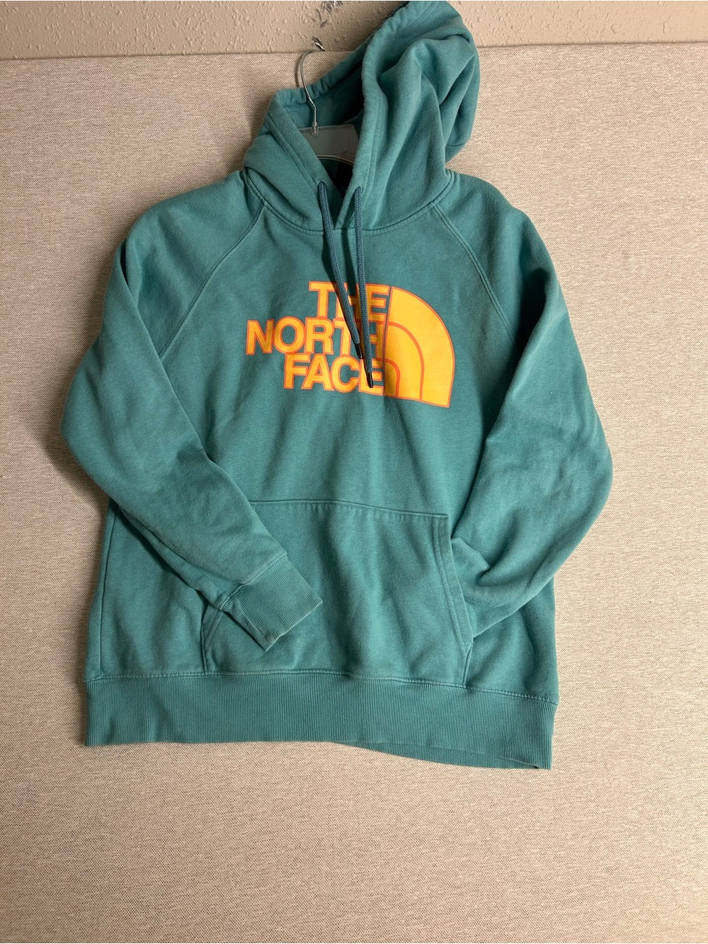 The North Face Teal Hoodie with Orange Logo
